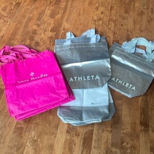 6 Athleta silver bags and 3 Vera Bradley bags